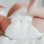 baby wearing non-toxic diaper with no blowouts